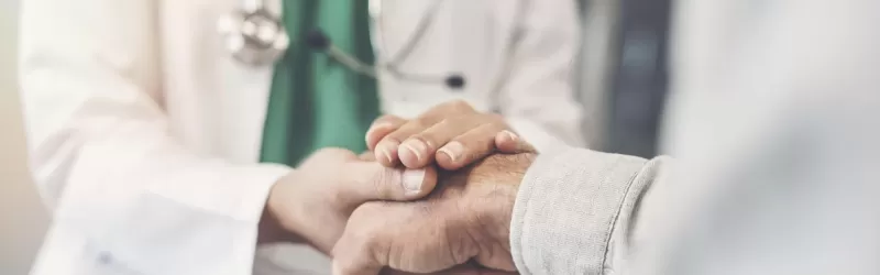 Doctor Holding Patient's Hand