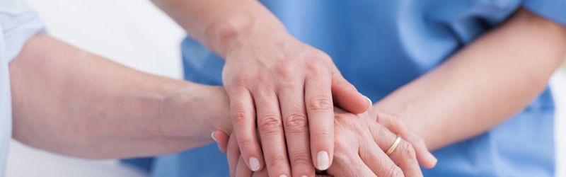 How Can Nurses Improve Patient Satisfaction? Nurse Holding Patient's Hand